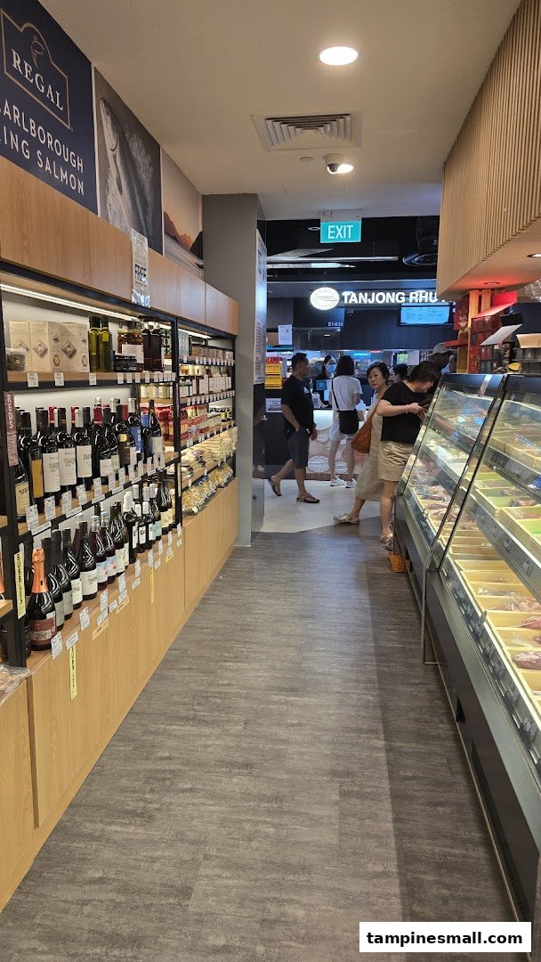 Interior view of Cut Butchery, showcasing shelves of gourmet products, a meat display, and customers browsing.