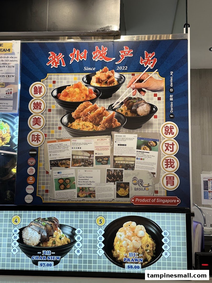 A vibrant menu board showcasing various scrambled egg rice bowls with prices and promotional text.