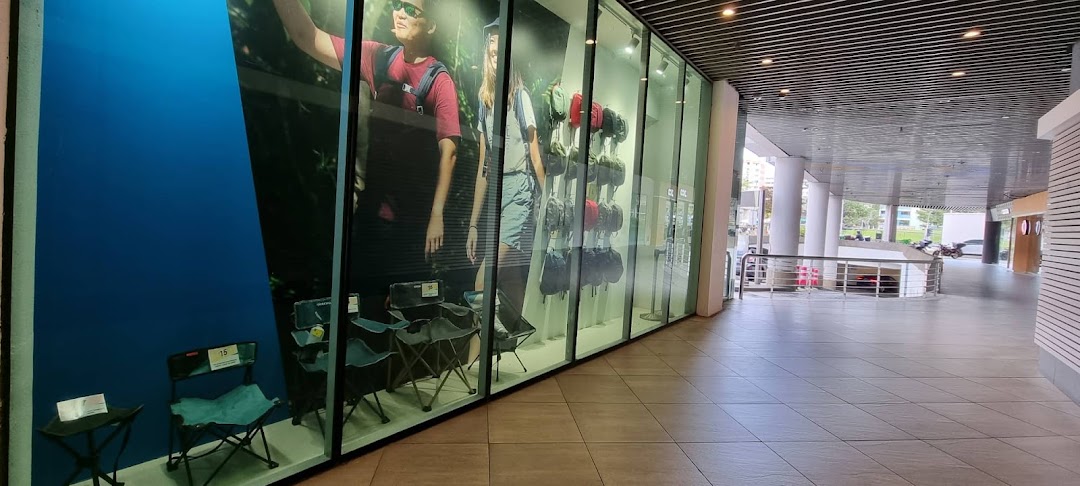 The storefront of Decathlon, featuring large window displays with outdoor gear and active lifestyle imagery.