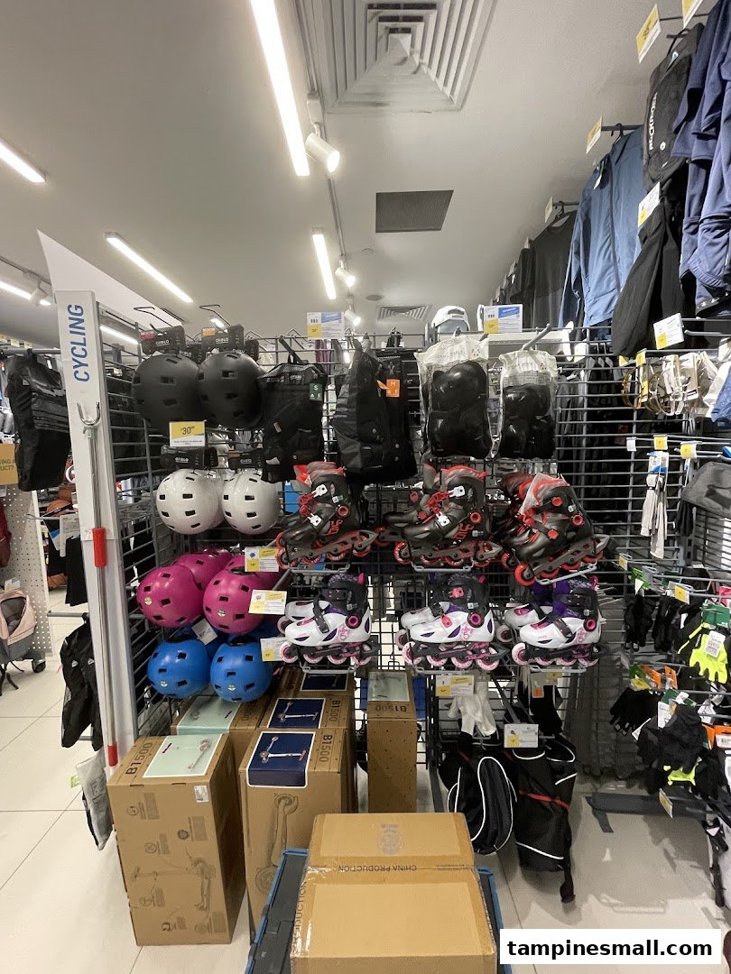An aisle at Decathlon showcasing rollerblades, helmets, and various sports equipment for active lifestyles.