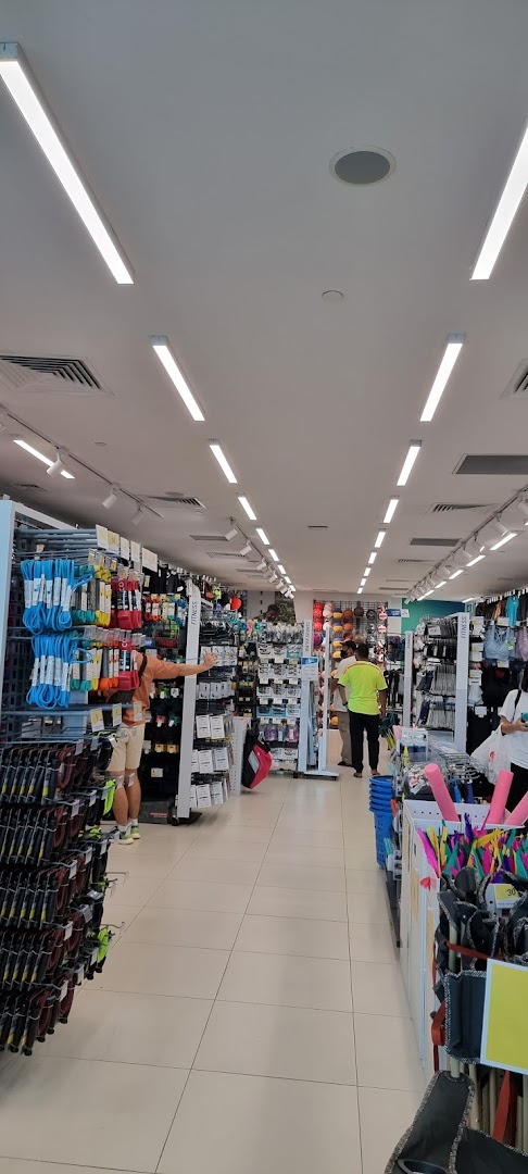 An interior view of Decathlon, showcasing aisles filled with various sports equipment and apparel.