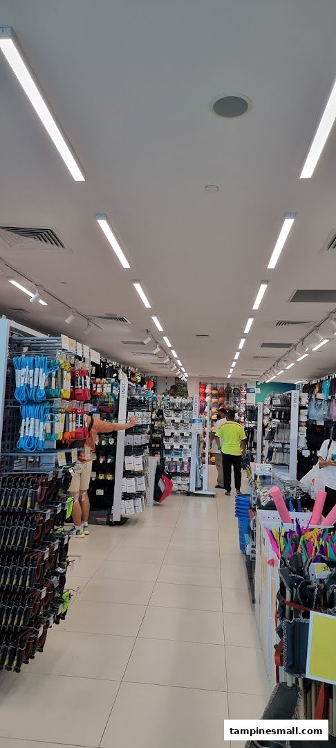 An interior view of Decathlon, showcasing aisles filled with various sports equipment and apparel.