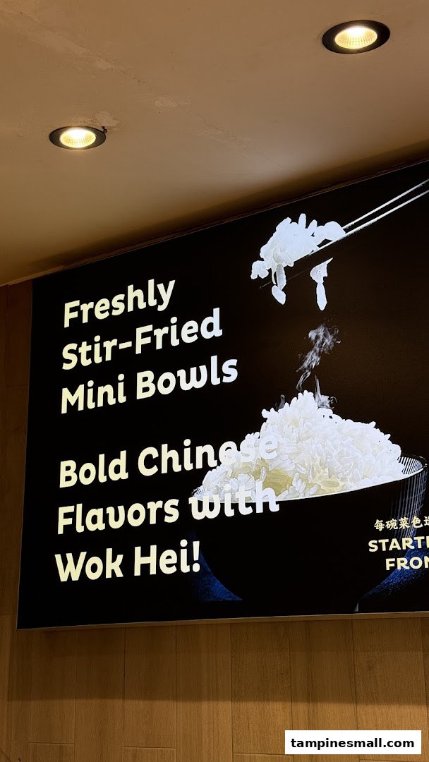 A promotional sign for Delibowl Rice Kitchen highlighting freshly stir-fried mini bowls.