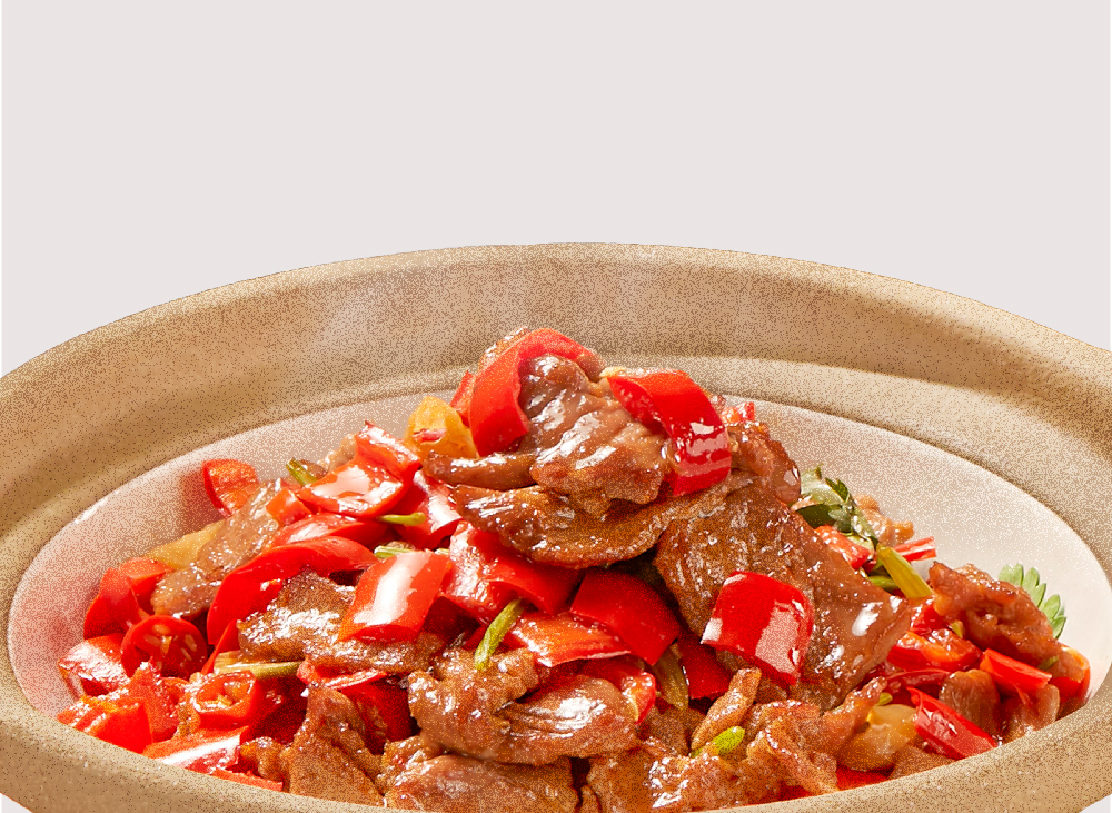 A close-up of a delicious stir-fried meat dish with vibrant red peppers in a rustic bowl.
