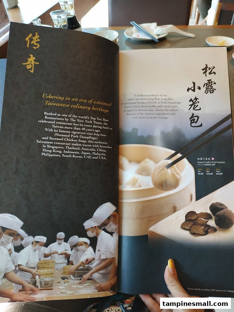 A Din Tai Fung menu displaying information about their heritage and signature truffle dumplings.