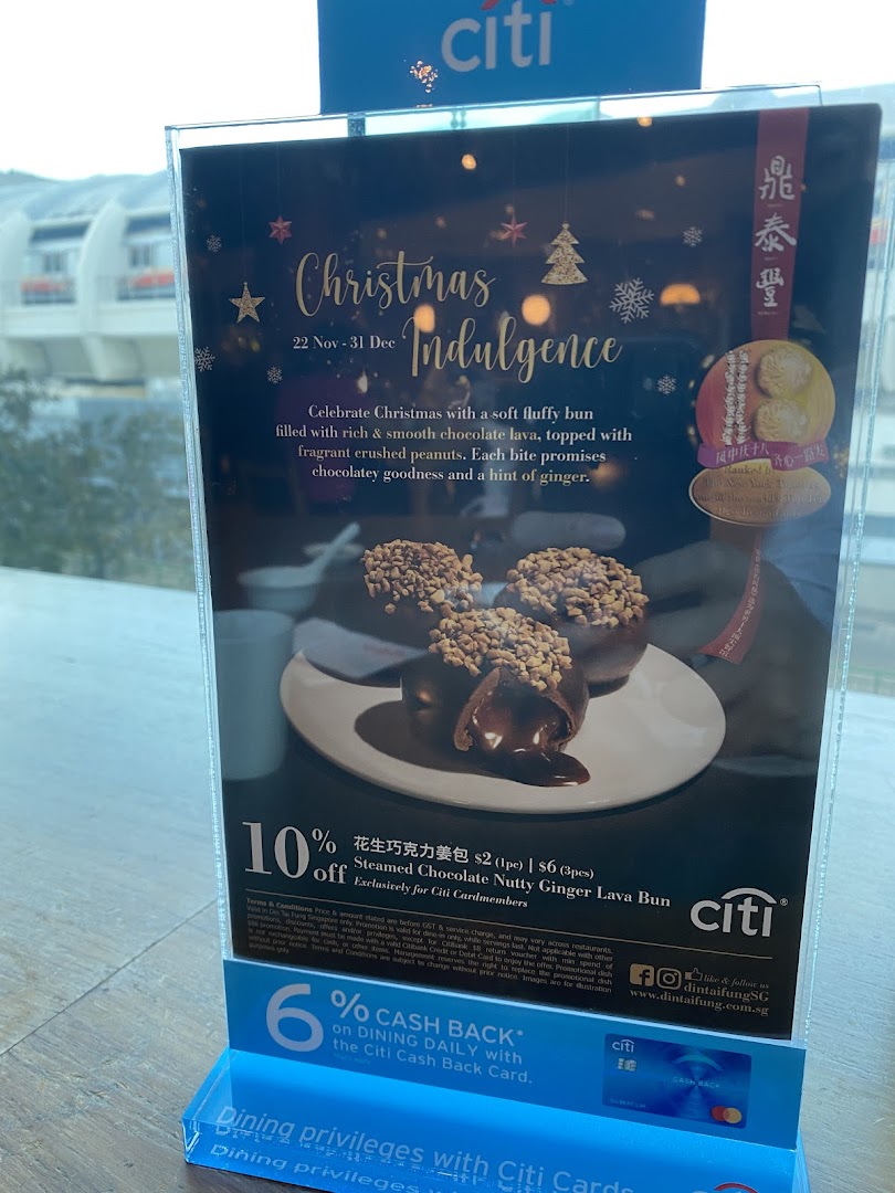 A promotional display for Din Tai Fung's Christmas Indulgence Steamed Chocolate Nutty Ginger Lava Bun with a Citi Bank discount.