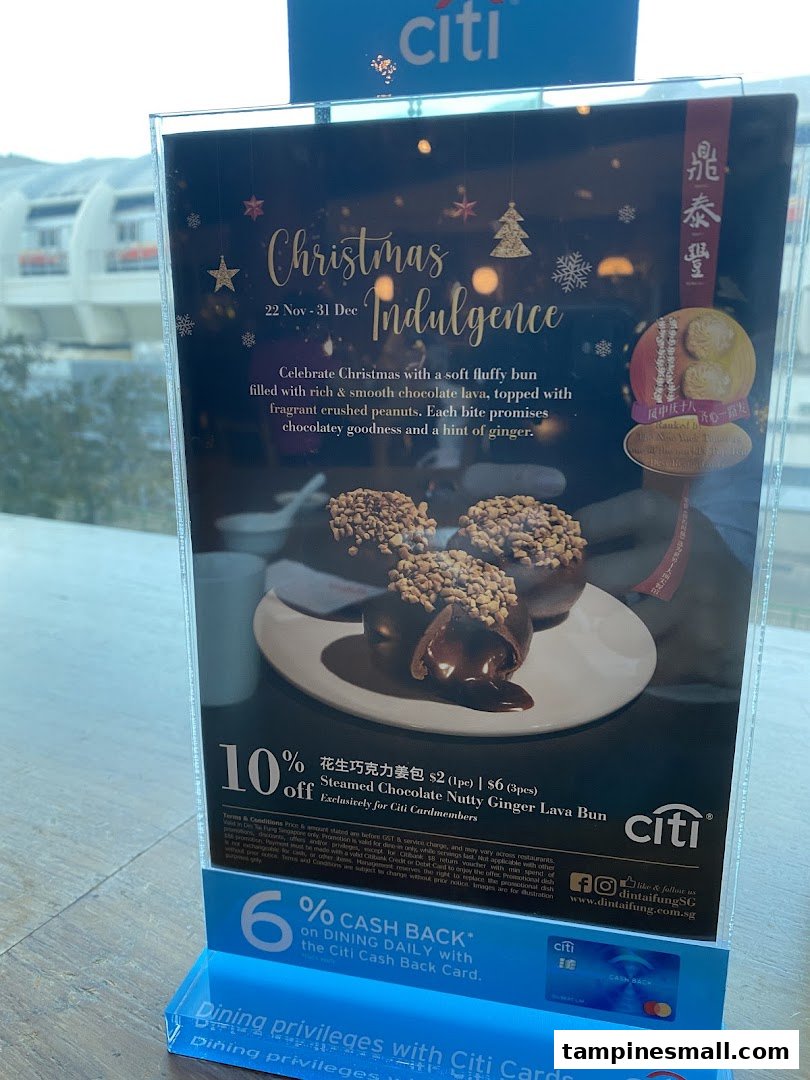 A promotional display for Din Tai Fung's Christmas Indulgence Steamed Chocolate Nutty Ginger Lava Bun with a Citi Bank discount.