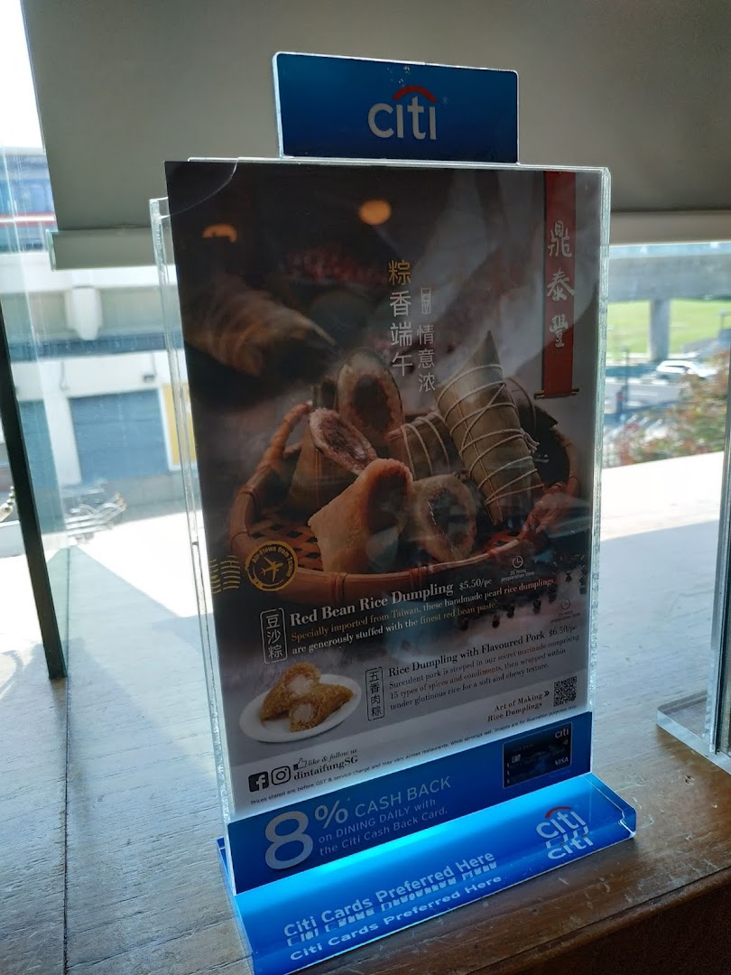 A promotional display stand featuring Din Tai Fung's special rice dumplings and a Citi Bank cashback offer.