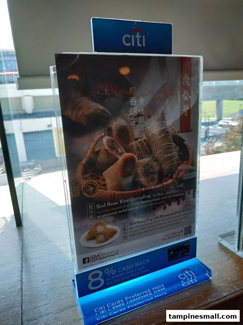 A promotional display stand featuring Din Tai Fung's special rice dumplings and a Citi Bank cashback offer.