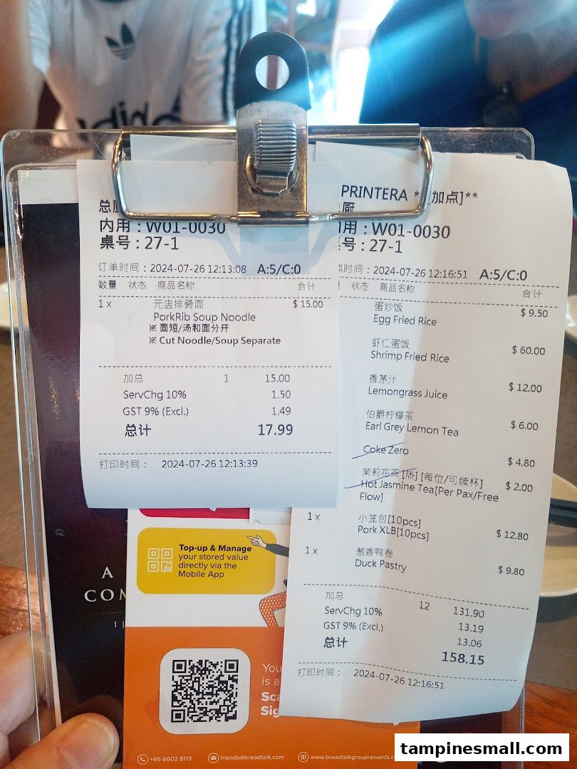 A detailed restaurant order slip from Din Tai Fung showing various food and drink items with their prices.