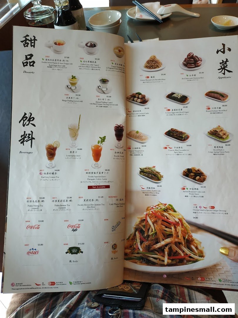 A detailed menu from Din Tai Fung, showcasing a variety of desserts, beverages, and appetisers with prices.