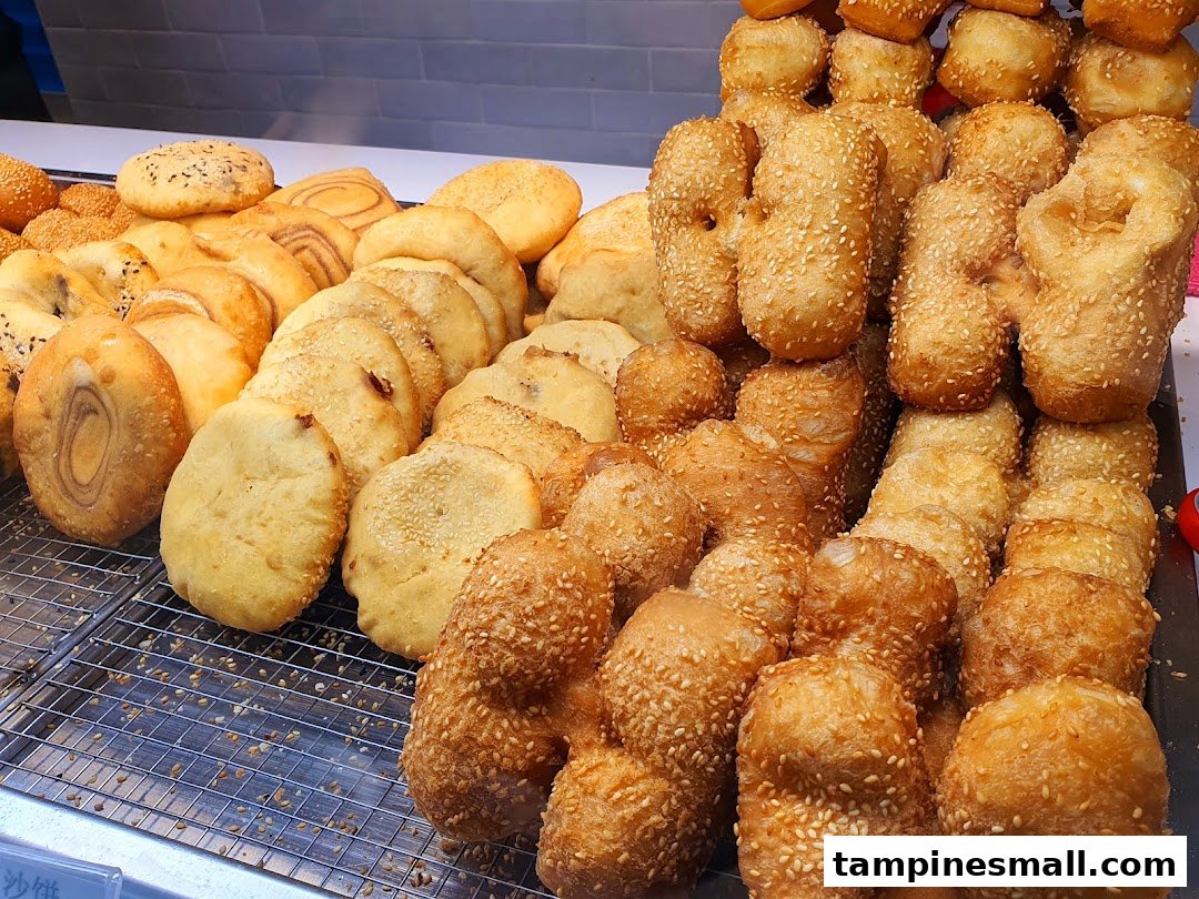A vibrant display of freshly fried golden-brown pastries and dough fritters at Dough Culture.