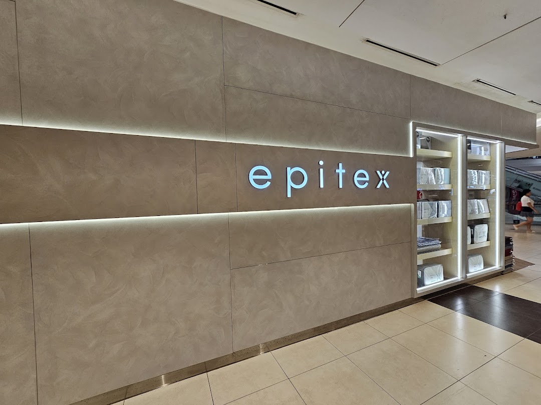 The Epitex shop front features a modern design with illuminated signage and a product display cabinet.