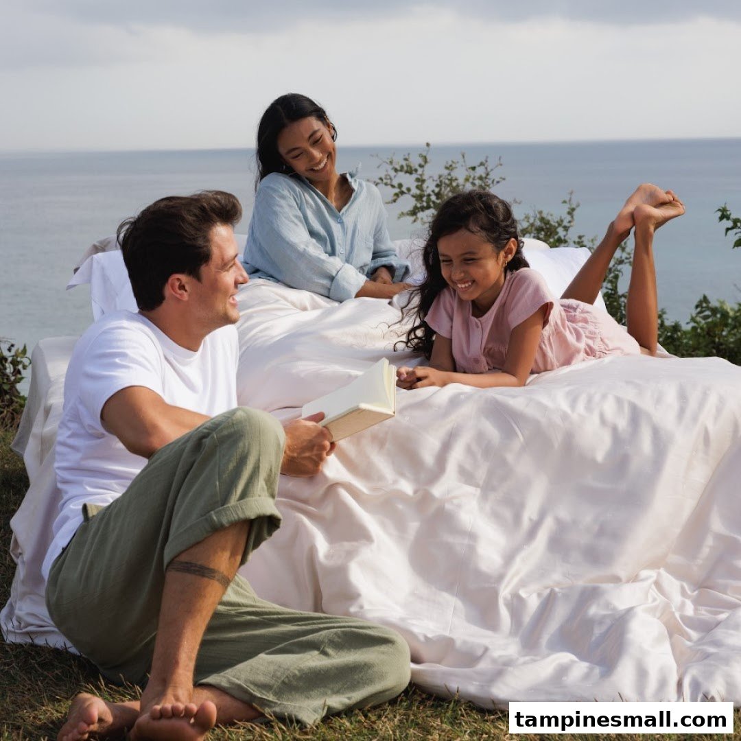 A family enjoys comfortable bedding outdoors by the sea, showcasing Epitex's quality and comfort.