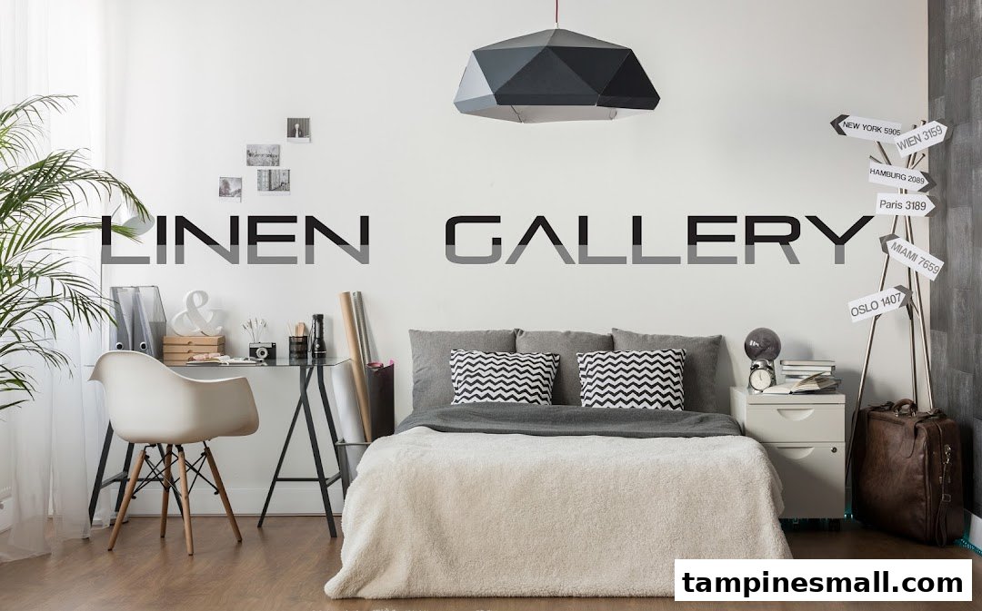 A stylish bedroom display featuring a bed with cozy linens, a modern desk, and decorative elements.
