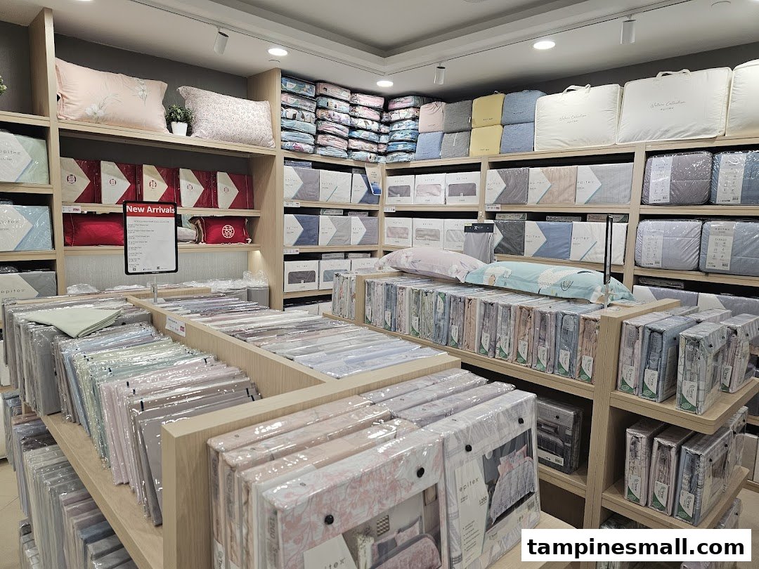 An interior view of Epitex, a bedding and home linen store, showcasing a wide array of pillows, duvets, and sheet sets.