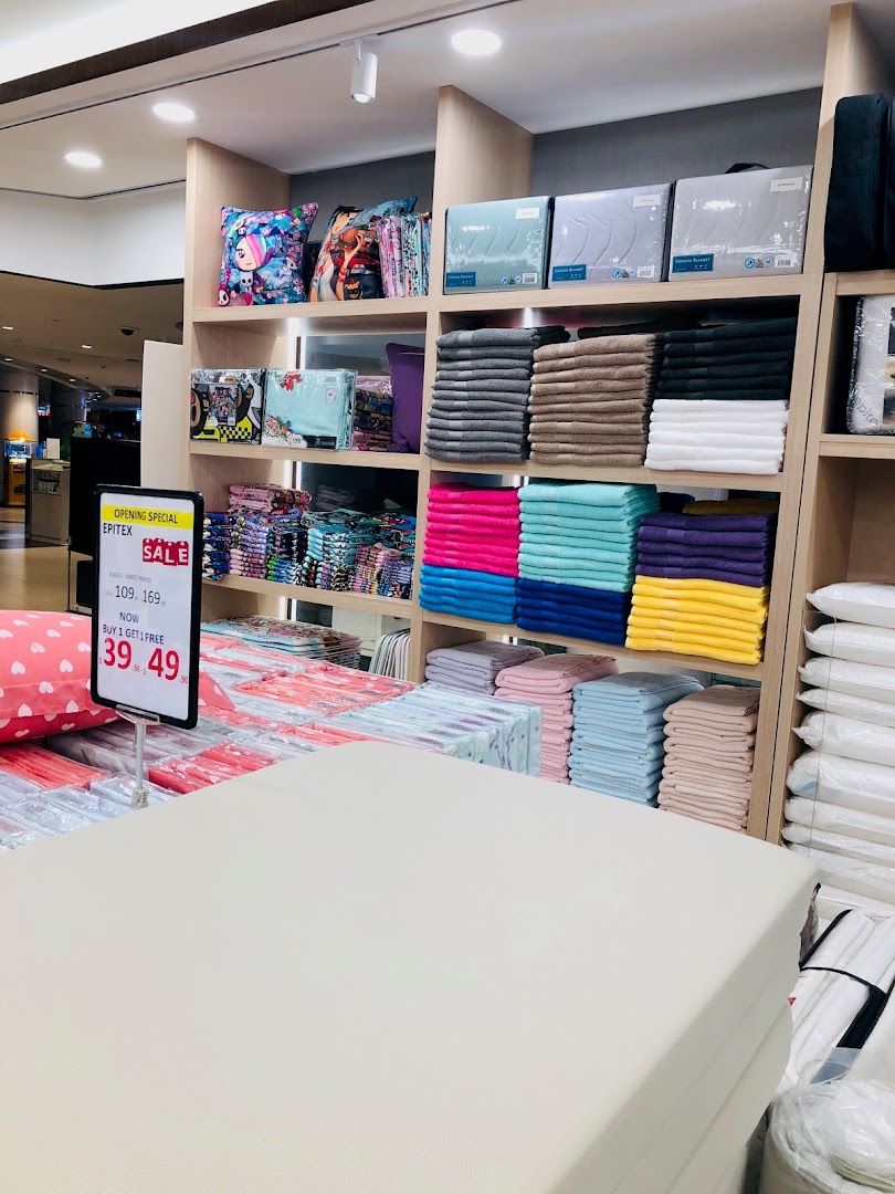 Interior view of Epitex, showcasing a wide array of colorful towels, bedding, and home textiles.