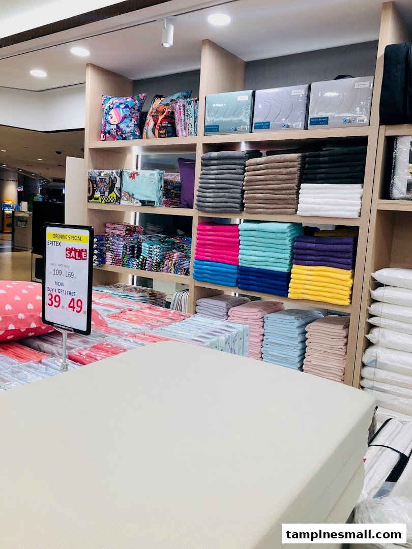 Interior view of Epitex, showcasing a wide array of colorful towels, bedding, and home textiles.