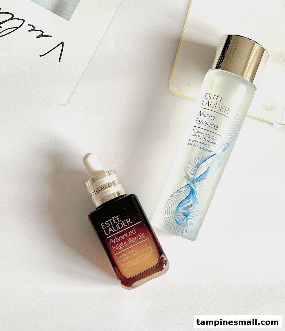 Two Estée Lauder skincare products, Advanced Night Repair serum and Micro Essence treatment lotion, displayed.