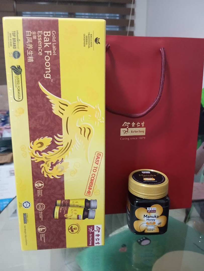 Eu Yan Sang Bak Foong Essence and Manuka Honey products with a red shopping bag.