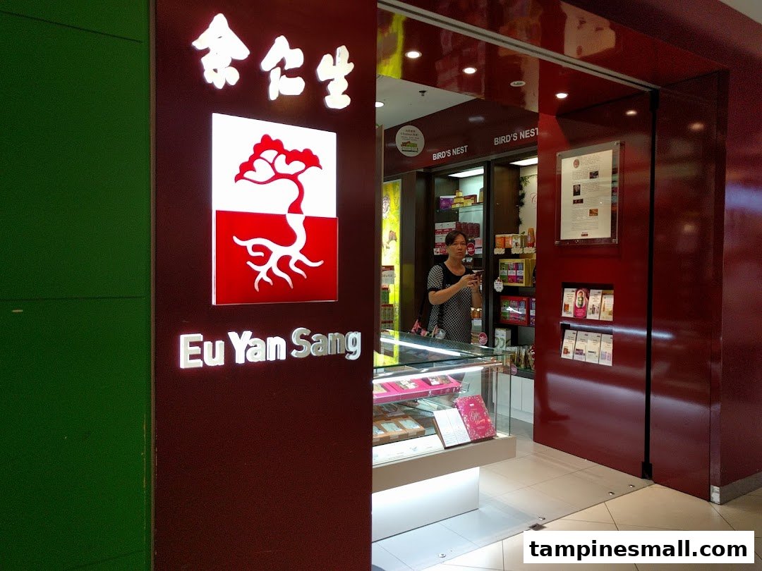 The entrance of Eu Yan Sang, a traditional Chinese medicine shop, with a staff member visible inside.