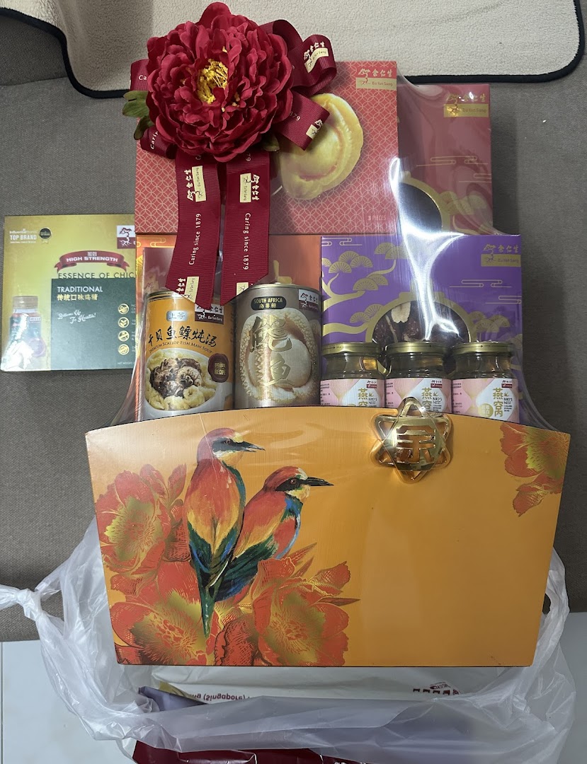 A festive gift basket from Eu Yan Sang featuring traditional health and wellness products.