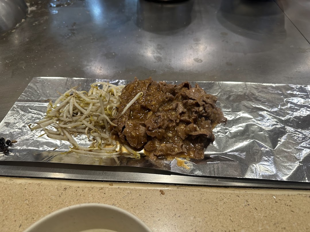 Delicious teppan-grilled meat and bean sprouts served on foil at Express Teppan-Yaki.