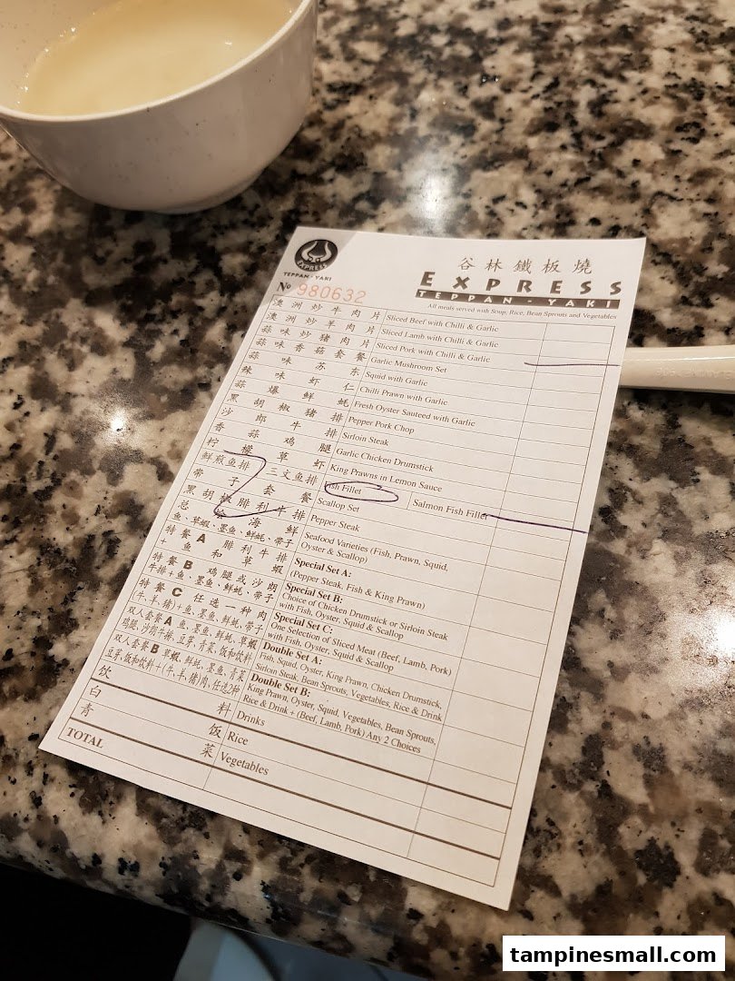 A close-up view of a menu order slip from Express Teppan-Yaki, showing various teppanyaki dishes.