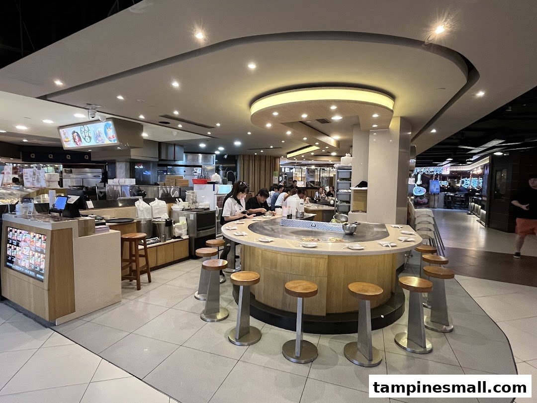 Diners enjoy fresh teppanyaki cooked live at the central counter of Express Teppan-Yaki Tampines Mall.