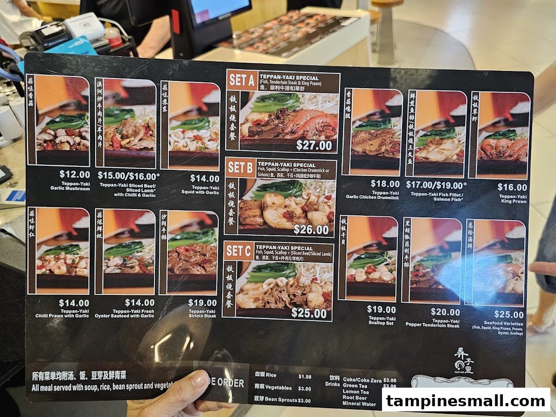 A close-up view of Express Teppan-Yaki's menu board displaying various teppanyaki sets and ala carte options.
