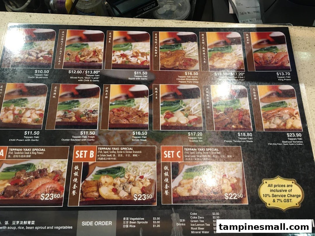 A detailed menu board displaying various Teppan-Yaki dishes, prices, and set meal options.