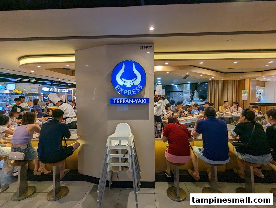 Customers enjoy fresh teppanyaki dishes cooked by chefs at Express Teppan-Yaki's counter.