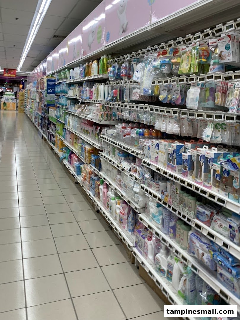 An aisle in FairPrice Tampines Mall stocked with a wide range of baby care products and essentials.