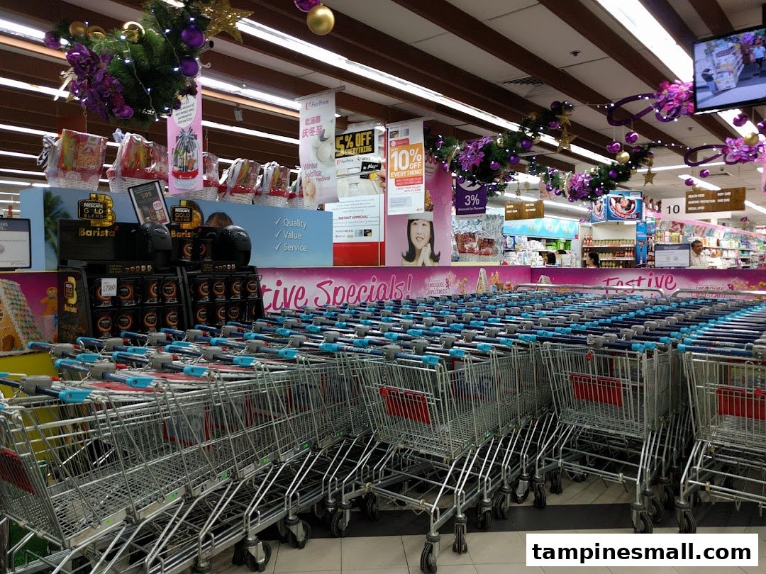 Interior view of FairPrice supermarket featuring rows of shopping carts, product displays, and festive decorations.