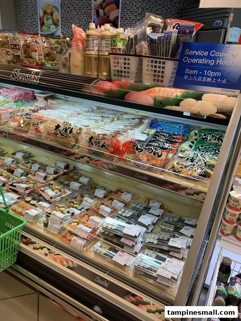 A refrigerated display case at FairPrice Tampines Mall showcasing pre-packaged sushi and Japanese food items.