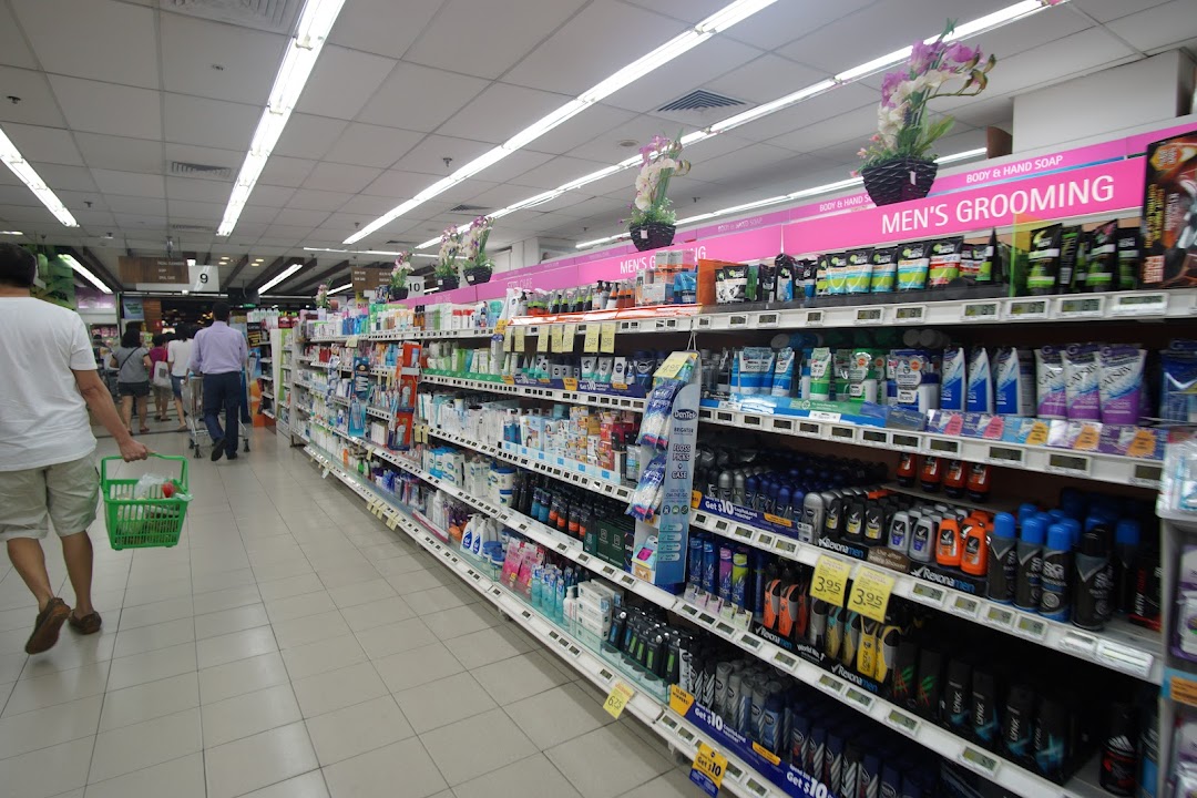 Shoppers browse a well-stocked aisle of personal care and grooming products at FairPrice Tampines Mall.