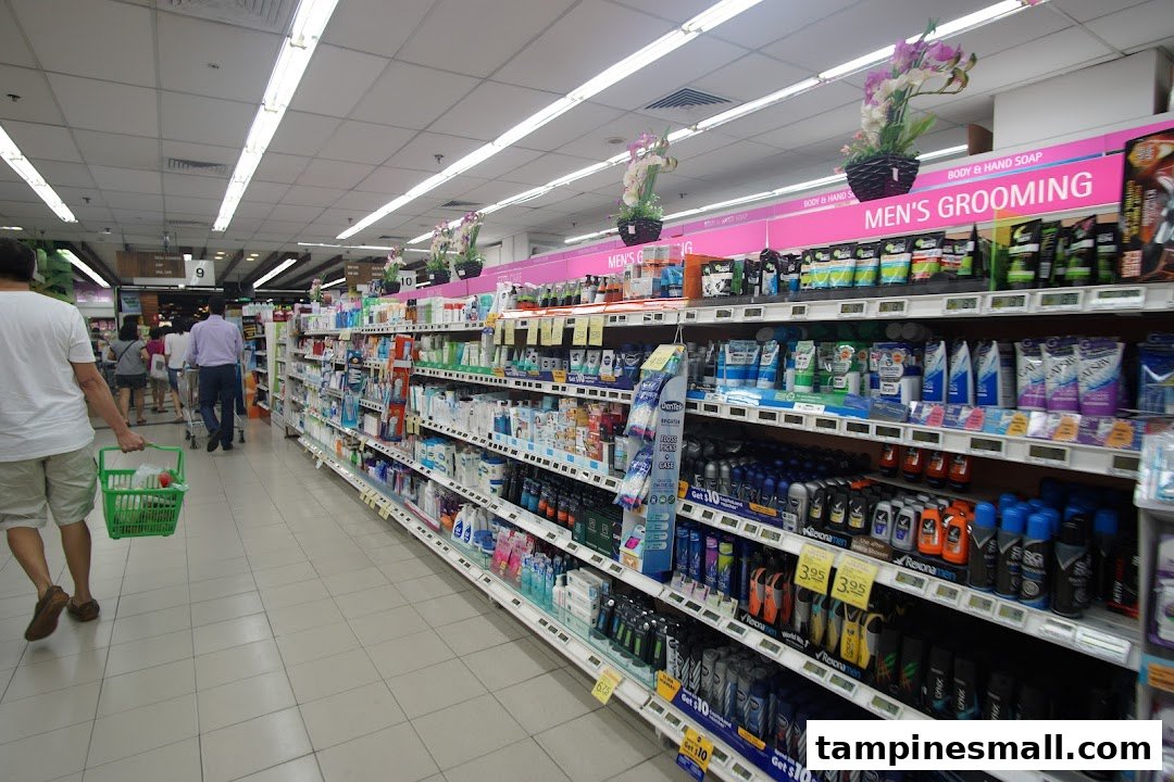 Shoppers browse a well-stocked aisle of personal care and grooming products at FairPrice Tampines Mall.
