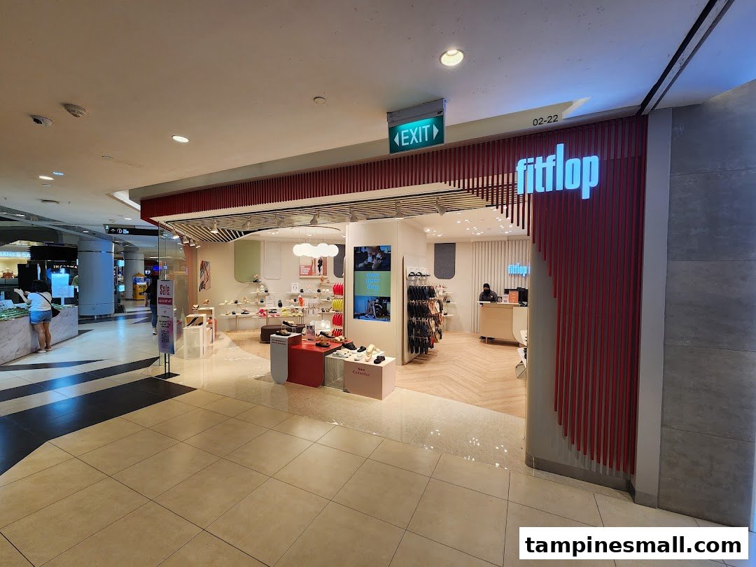 The inviting shop front of FitFlop Tampines, showcasing its entrance, prominent signage, and interior displays.