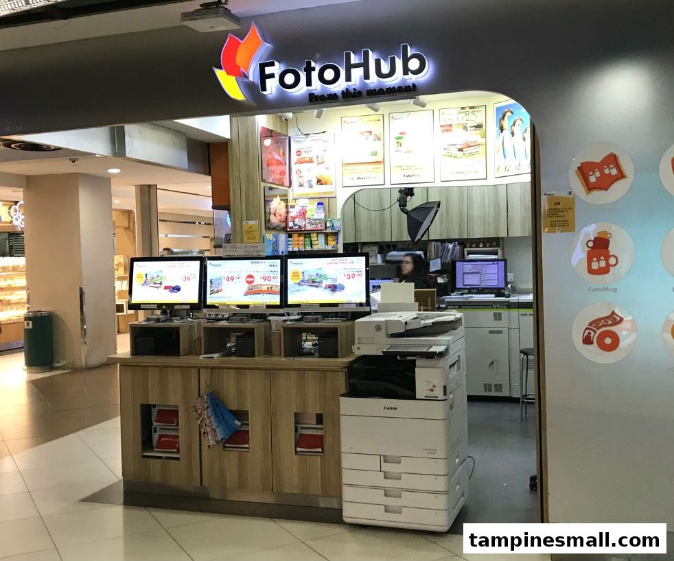 FotoHub shop entrance featuring self-service kiosks, printing equipment, and vibrant signage.