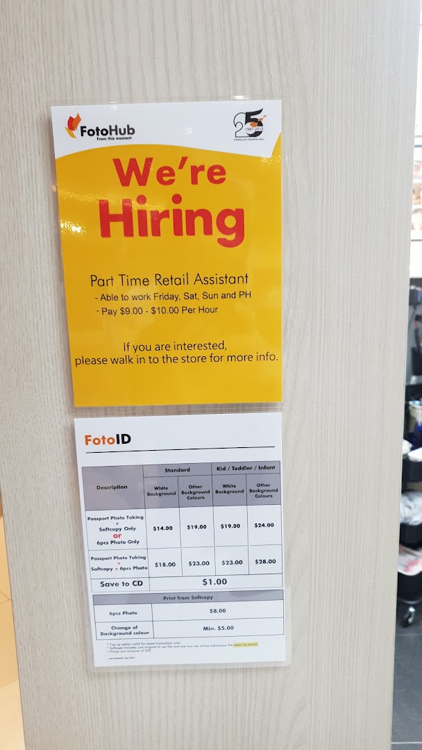 A price list for passport photo services and a 'We're Hiring' sign at FotoHub.