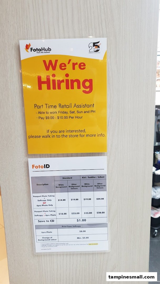 A price list for passport photo services and a 'We're Hiring' sign at FotoHub.