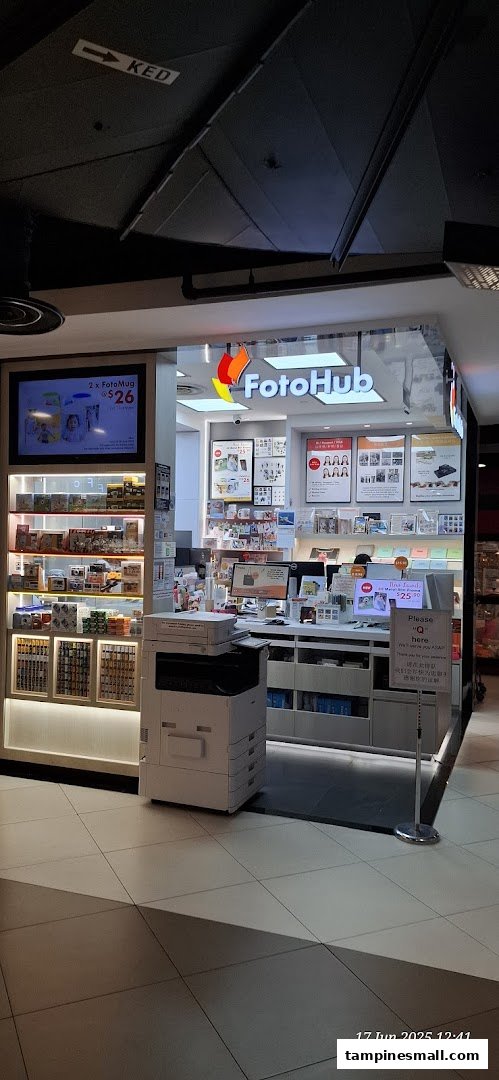 The FotoHub shop front displays its logo, photo printing services, and personalized gift options like FotoMugs.