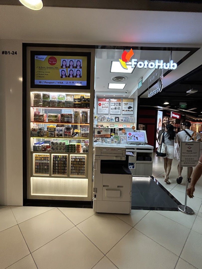 The FotoHub shop front at Tampines Mall, showcasing photo services and products.