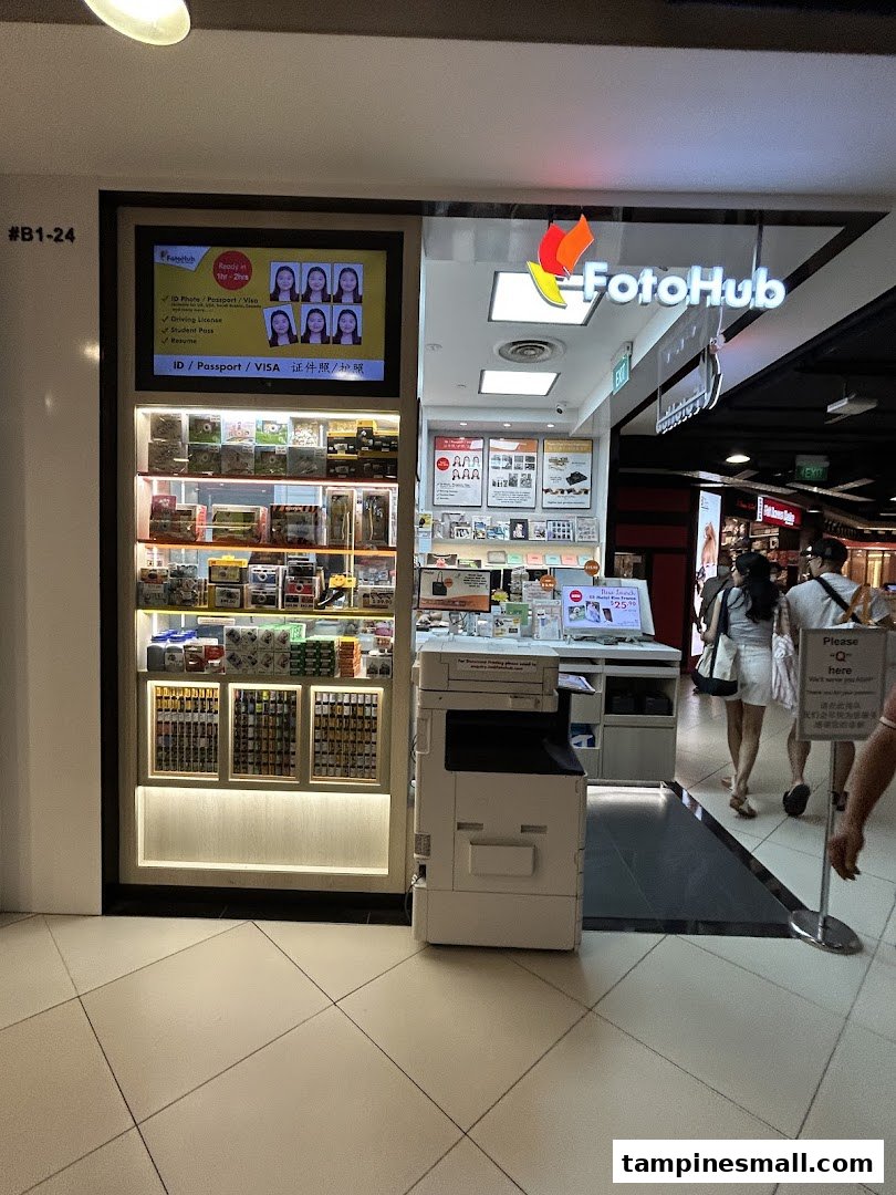 The FotoHub shop front at Tampines Mall, showcasing photo services and products.