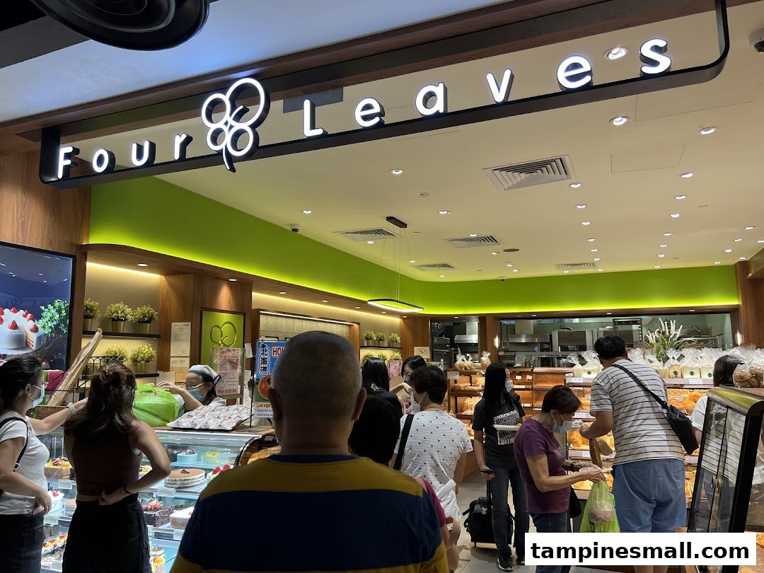Customers browse a wide selection of freshly baked bread and cakes inside the Four Leaves bakery.