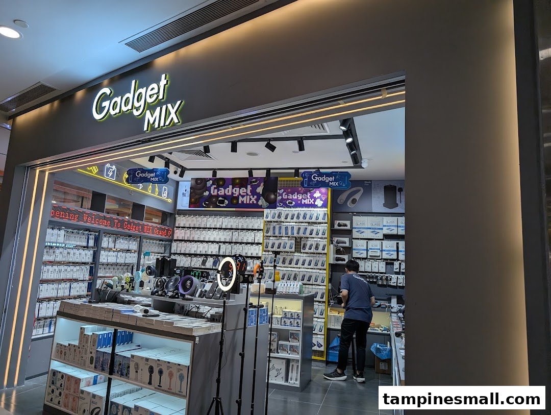 The brightly lit entrance of Gadget Mix, a tech accessories store, with products and a customer visible inside.