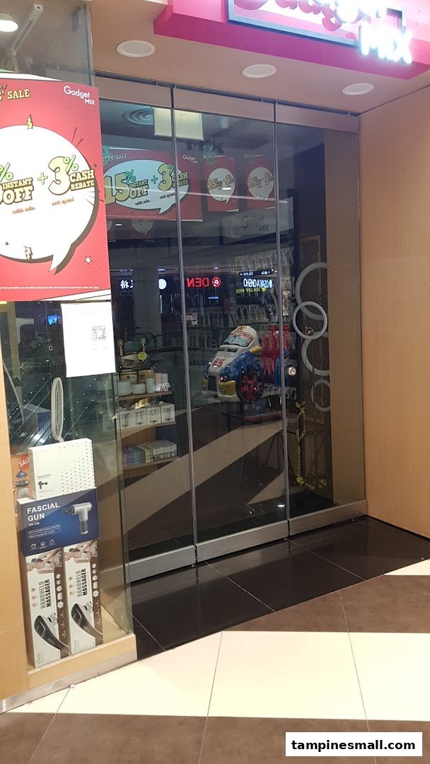 Glass storefront of Gadget Mix, showcasing promotions and products inside.