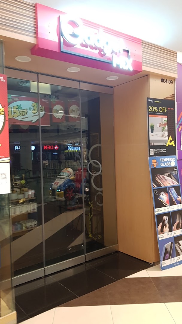 The storefront of Gadget Mix, featuring its illuminated sign, glass entrance, and tech accessory displays.