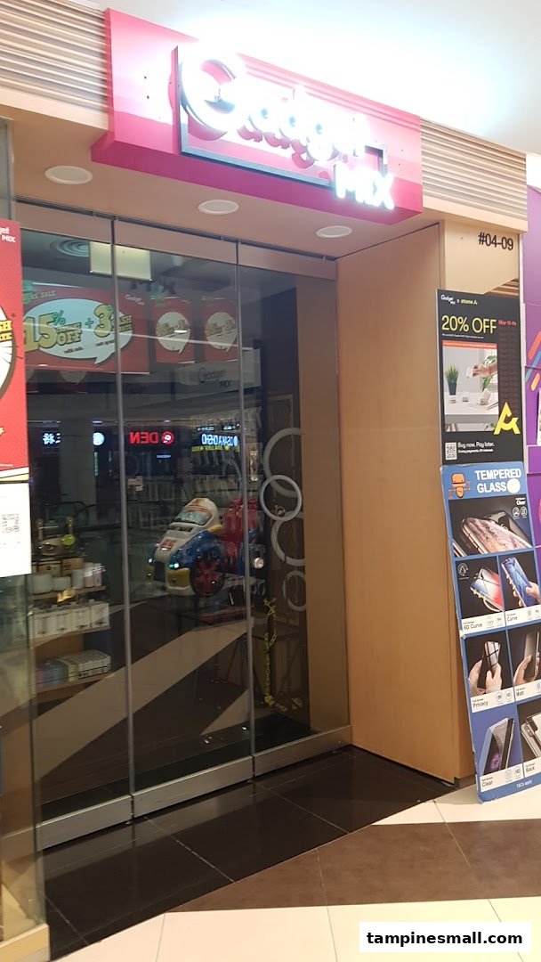 The storefront of Gadget Mix, featuring its illuminated sign, glass entrance, and tech accessory displays.