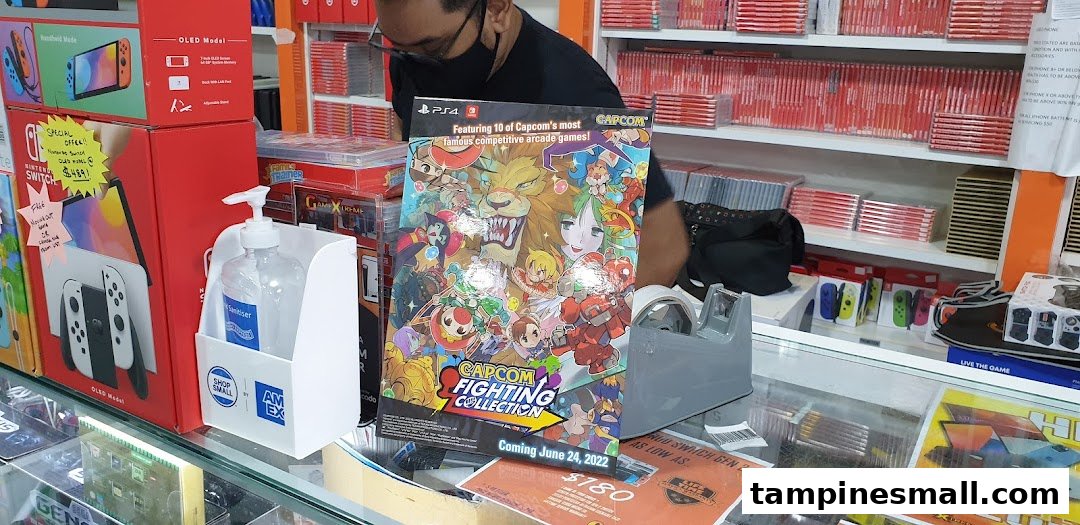 An interior shot of GameXtreme Tampines, featuring gaming consoles, accessories, and a new game display.
